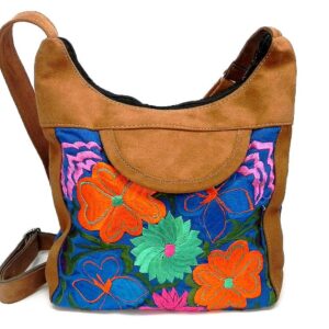 Square-shaped hobo crossbody purse bag with multicolored embroidered floral designs, brown vegan leather suede, and blue fabric.