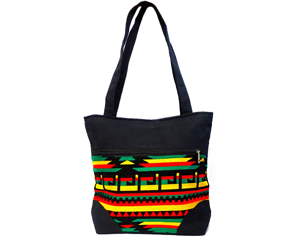 Handmade extra large slightly cushioned tote purse bag with Aztec inspired tribal print striped pattern material and vegan suede in Rasta colors.