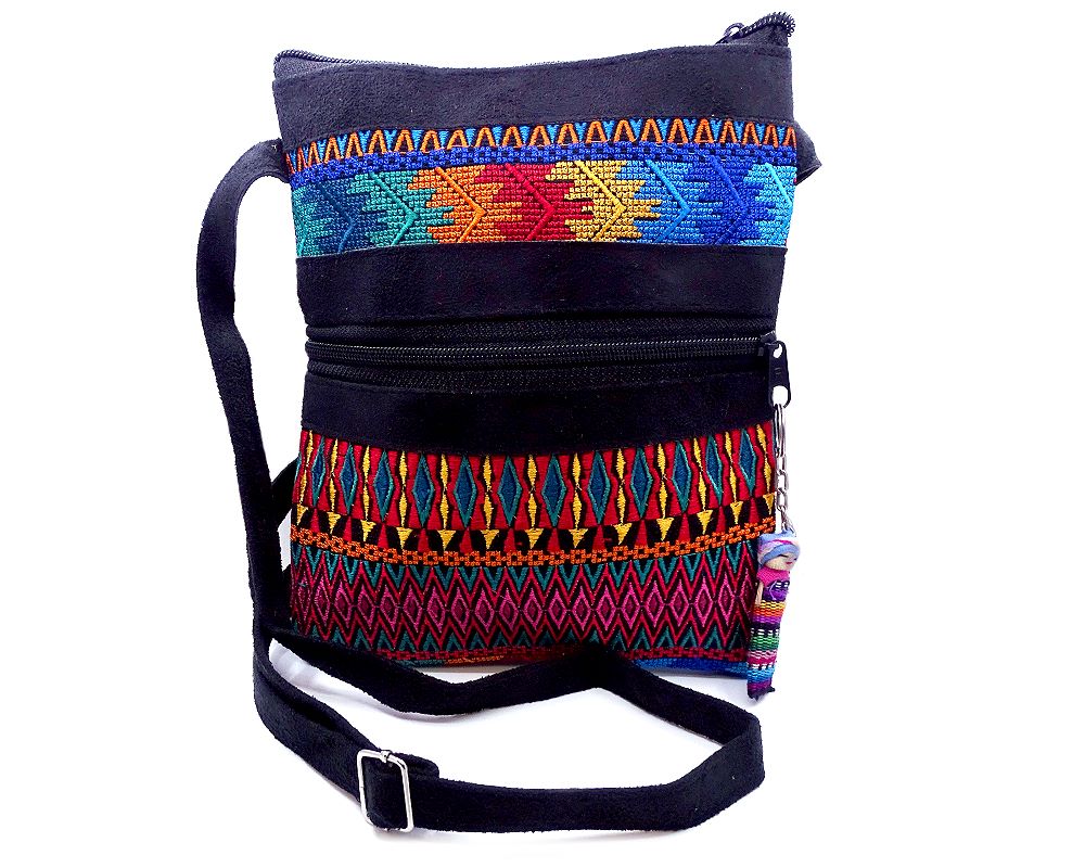 Handmade medium-sized slim rectangle-shaped crossbody purse bag with multicolored huipil embroidered tribal pattern design, black vegan leather suede, and worry doll keychain.