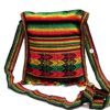 Handmade medium-sized slim square-shaped purse bag with multicolored tribal print pattern material (or manta Inca) and fringe in Rasta colors.