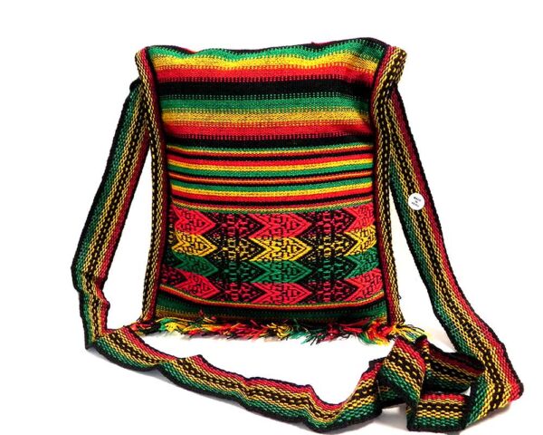 Handmade medium-sized slim square-shaped purse bag with multicolored tribal print pattern material (or manta Inca) and fringe in Rasta colors.