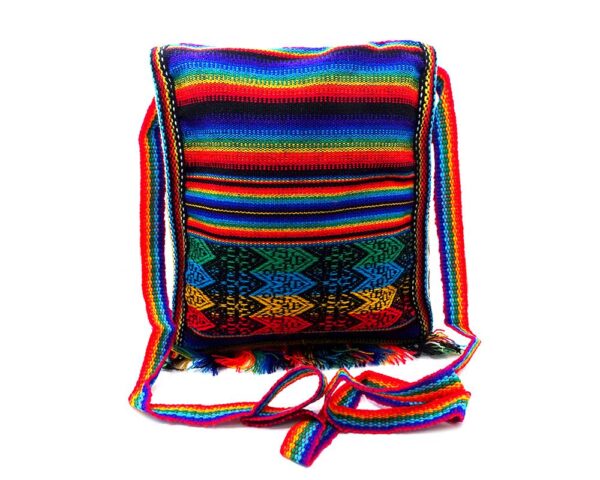Handmade medium-sized slim square-shaped purse bag with multicolored tribal print pattern material (or manta Inca) and fringe in rainbow colors.