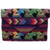 Handmade slim envelope purse bag with floral tribal huipil embroidered cotton material, magnetic snap closure, and a crossbody strap in black and neon multicolored color combination.