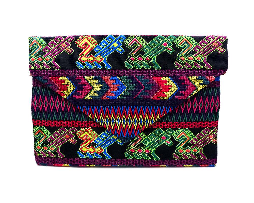 Handmade slim envelope purse bag with tribal huipil embroidered cotton material, magnetic snap closure, and a crossbody strap in black and neon multicolored color combination.