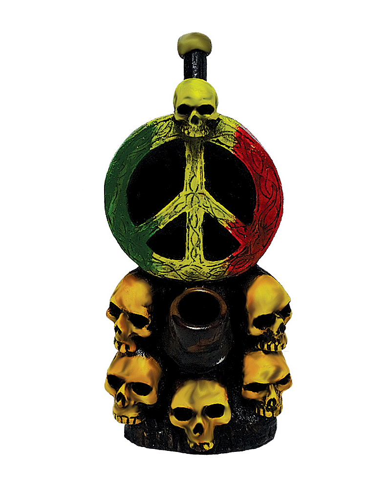 Handcrafted medium-sized tobacco smoking hand pipe of a peace sign symbol in Rasta colors with a pile of skulls.