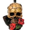 Handcrafted medium-sized tobacco smoking hand pipe of a skull with red roses in its mouth.