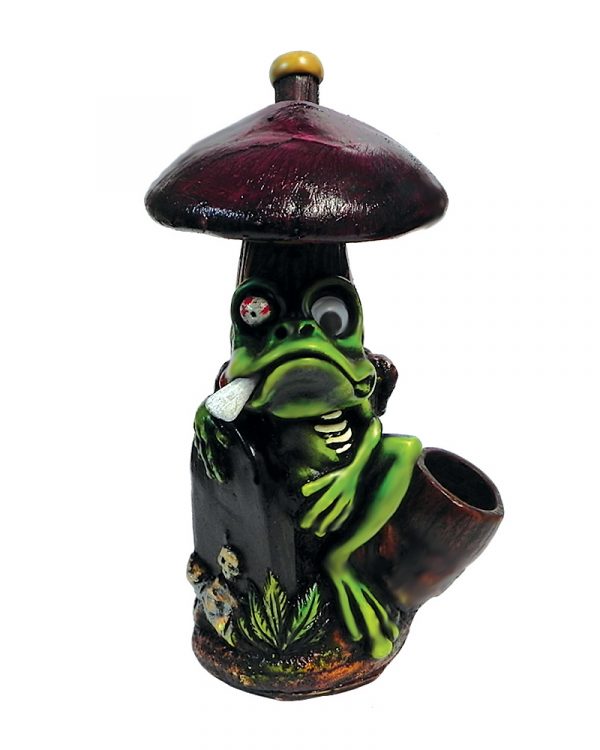 Handcrafted medium-sized tobacco smoking hand pipe of a green smoking zombie frog with googly eyes under a purple mushroom with a tombstone.