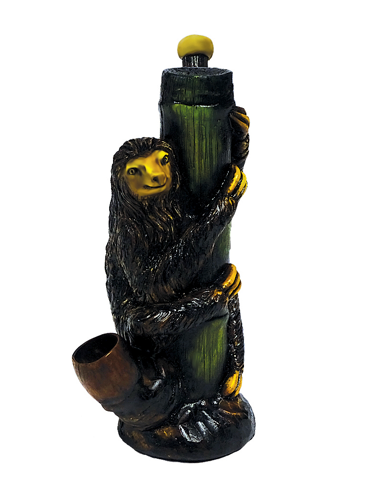 Handcrafted medium-sized tobacco smoking hand pipe of a sloth on a green tree branch.