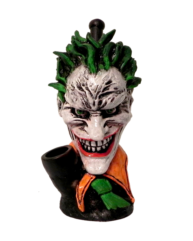 Handcrafted medium-sized tobacco smoking hand pipe of an evil clown character with a big head, creepy smile, green hair, and suit.