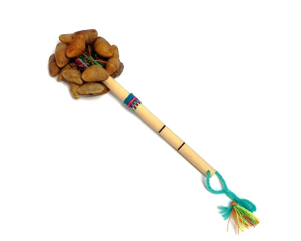 Handmade bamboo wooden stick rattle shaker music instrument with cacho seed pods and a cotton strap on handle.