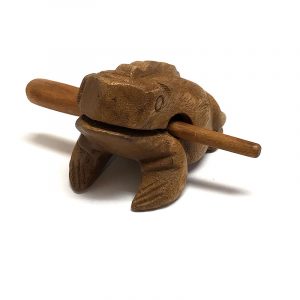 Handmade wooden croaking frog figurine rasp music instrument with stick in tan brown color.