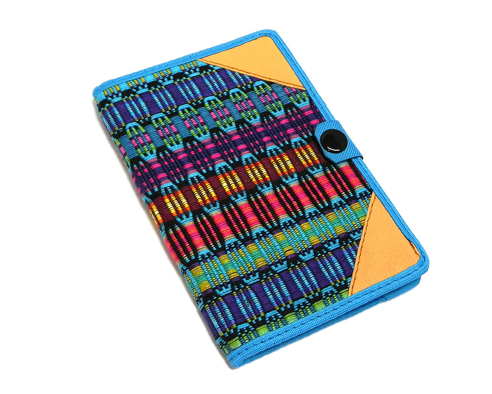 Handmade small woven cotton refillable notebook cover with multicolored stripes in turquoise blue color.