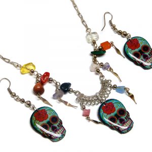 Day of the Dead floral rose sugar skull head acrylic necklace with multicolored chip stones and matching dangle earrings in mint, red, black, and white color combination.