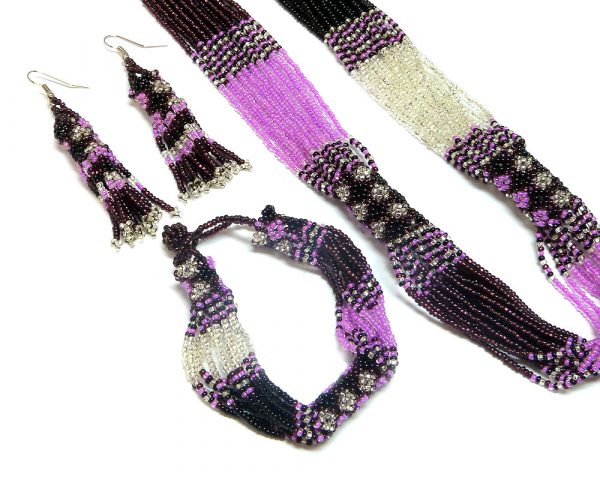Handmade Czech glass seed bead multi strand necklace, matching bracelet, and beaded fringe dangle earrings with diamond pattern design in pink, burgundy, white silver, and black color combination.