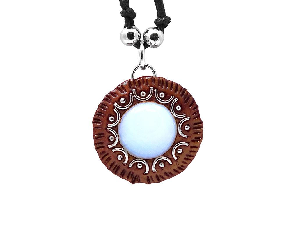 Handmade round-shaped gemstone cabochon crystal pendant with silver metal and brown resin border on adjustable necklace in black onyx.