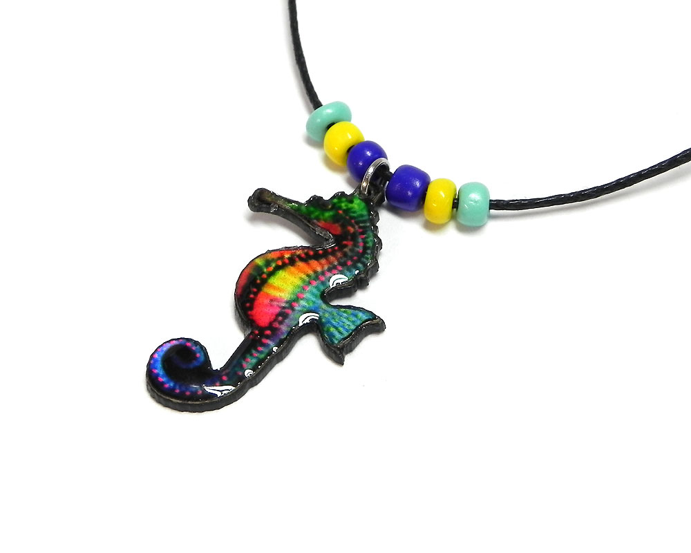 Handmade tropical seahorse acrylic pendant with seed beads on black necklace in turquoise mint, yellow, blue, and multicolored color combination.