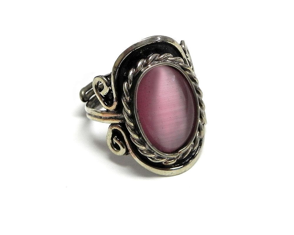 Handmade small oval-shaped cat's eye glass bead cabochon on adjustable alpaca silver metal ring with rope edge border in pink color.