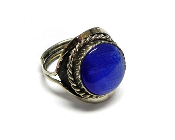 Handmade small round-shaped cat's eye glass bead cabochon on adjustable alpaca silver metal ring with rope edge border in blue color.