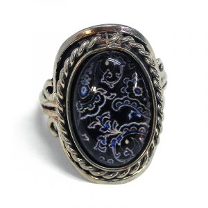 Handmade small oval-shaped acrylic vintage themed floral graphic design on alpaca silver metal ring with rope edge border in black, white, and blue color combination.