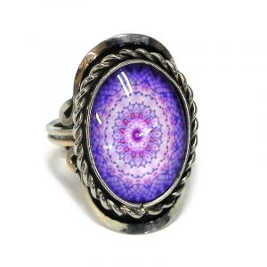 Handmade small oval-shaped acrylic New Age themed mandala graphic design on alpaca silver metal ring with rope edge border in purple, lavender, pink, and lilac color combination.