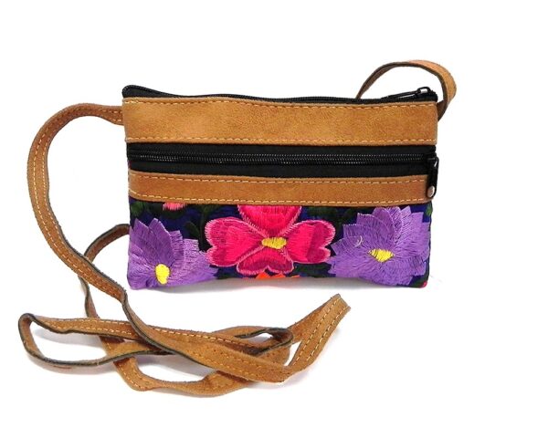Handmade small leather floral purse bag with tan vegan suede, embroidered cotton, zipper closure, outer pocket, and strap with blue fabric.