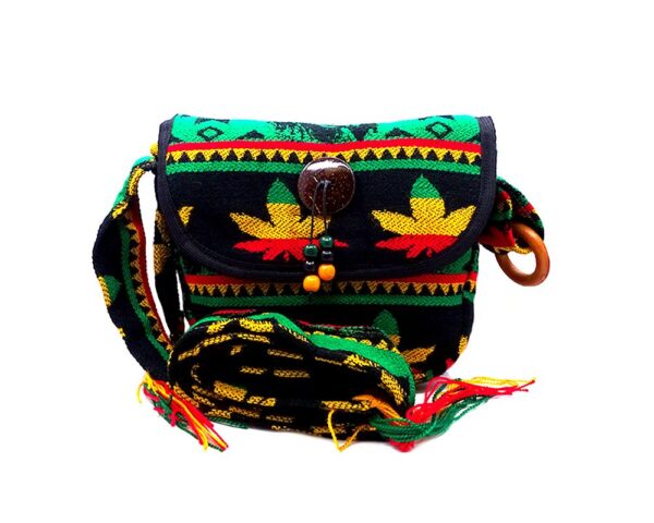Handmade small cushioned half moon purse bag with multicolored tribal print striped pattern, pot leaf design, fringe, and coconut button and beads in Rasta colors.