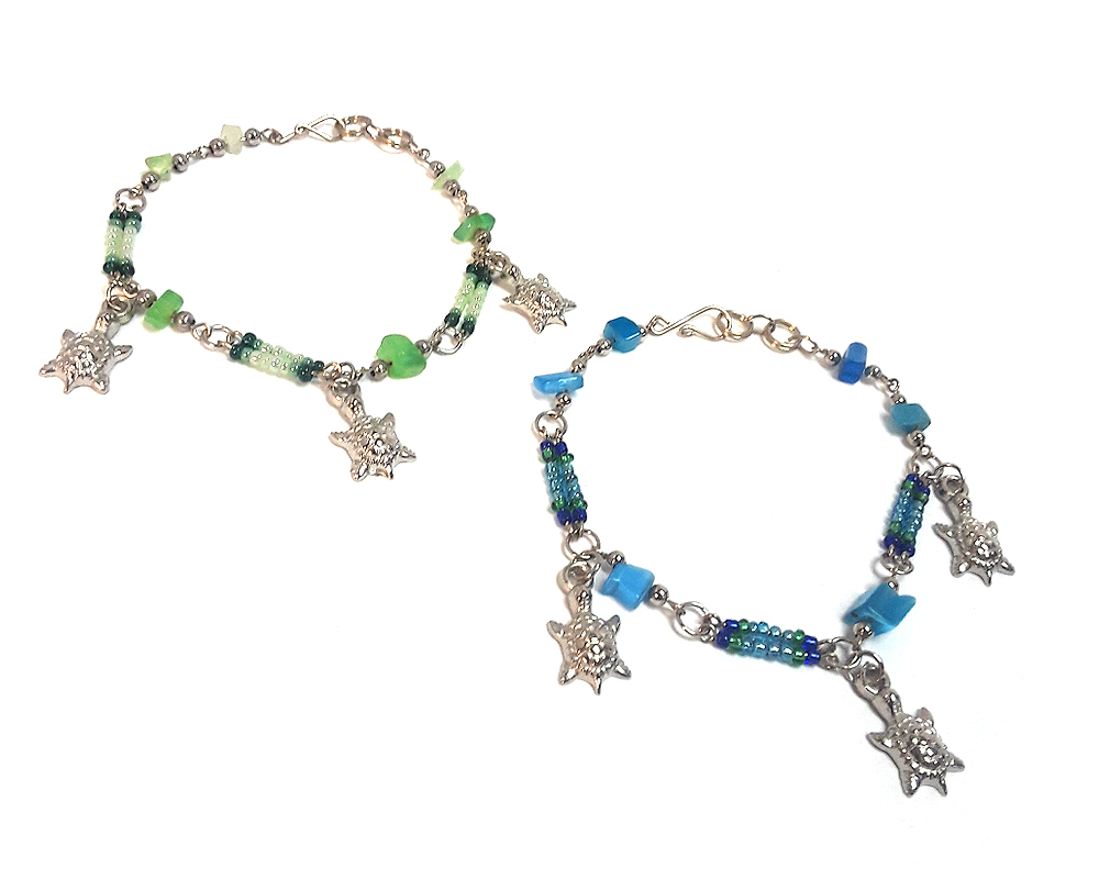 Seed bead and chip stone alpaca silver metal chain bracelet with three sea turtle charm dangles.