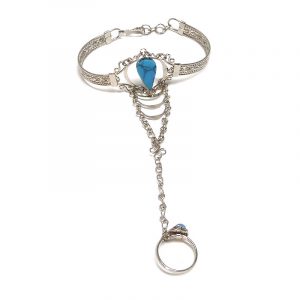 Handmade alpaca silver metal cuff harem bracelet with teardrop-cut gemstone crystal cabochon centerpiece, chain linked to mini ring in turquoise blue howlite.