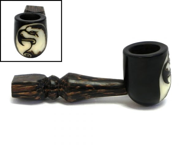 Handcarved tobacco smoking natural tagua nut hand pipe of an eagle head profile in small size.