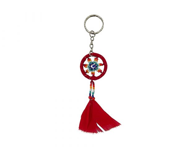 Handmade round suede leather beaded dream catcher keychain with multicolored seed beads, natural feather dangles, and silver metal keyring in red color.