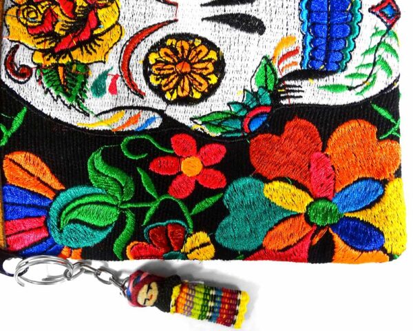 Handmade medium-sized slim rectangular brown vegan leather purse bag with cotton embroidered Day of the Dead sugar skull and floral designs in black and multicolored color combination.