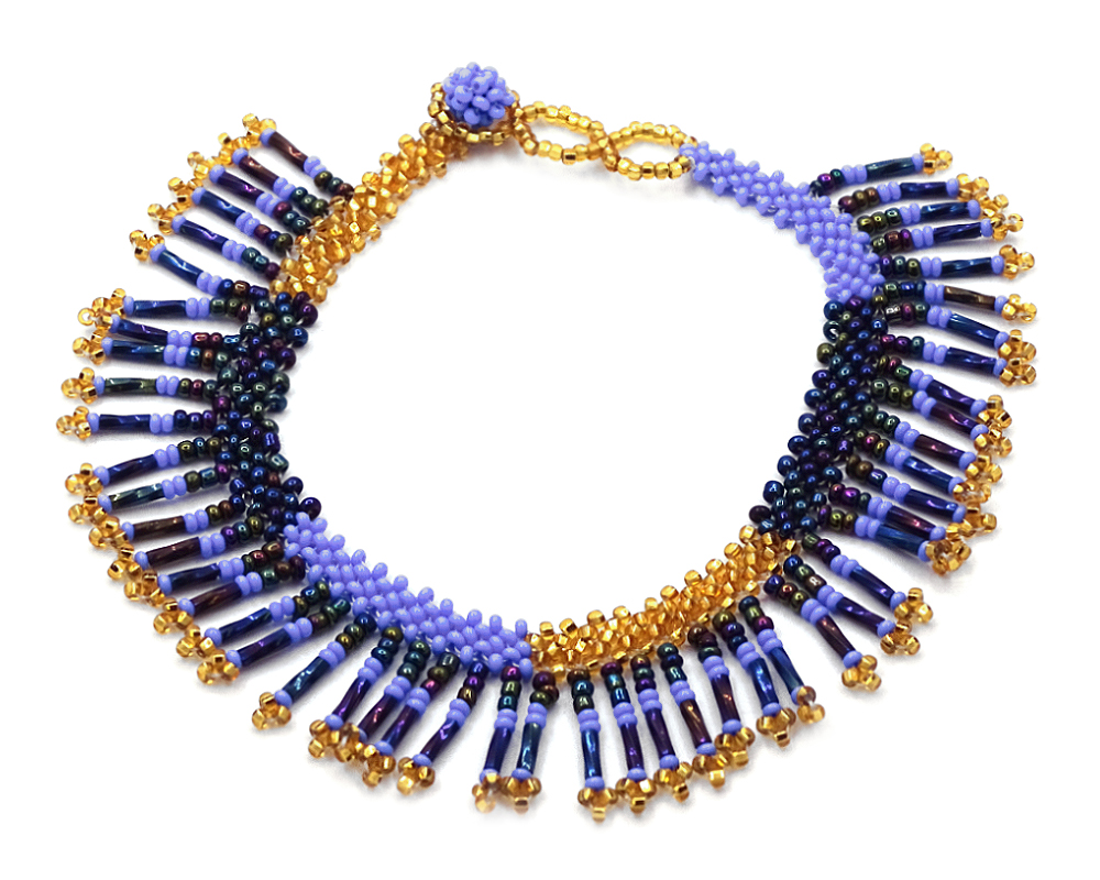 Handmade Czech glass seed bead anklet with multiple bugle beaded fringe dangles in periwinkle blue, iridescent navy, and gold color combination.