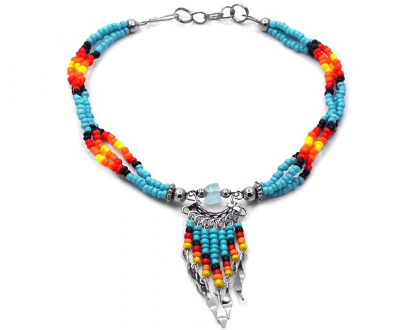 Handmade Native American inspired seed bead multi strand anklet with chip stone and beaded dangles in turquoise blue, black, red, orange, and yellow color combination.