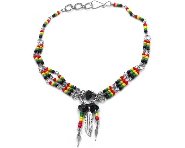 Seed bead silver metal chain anklet with round metal hoop, chip stone, metal feather charm, and beaded dangles in Rasta colors.