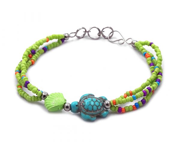 Handmade multicolored seed bead multi strand bracelet with seashell bead and sea turtle shaped tumbled magnesite gemstone crystal centerpiece in lime green, turquoise, and multicolored color combination.