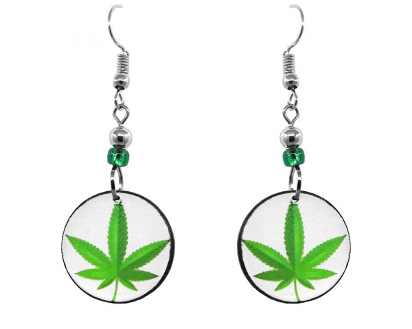Handmade small round-shaped cannabis pot leaf graphic acrylic dangle earrings with beaded metal hooks in white and lime green.