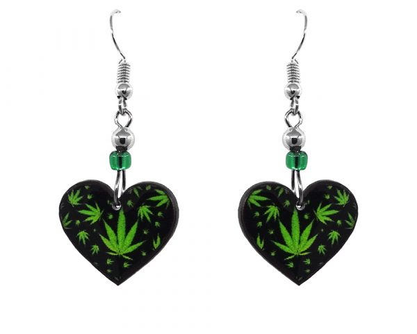 Handmade small heart-shaped cannabis pot leaf graphic acrylic dangle earrings with beaded metal hooks in black and lime green color combination.