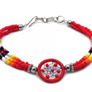 Handmade native American inspired multicolored seed bead multi strand bracelet with round beaded thread dream catcher centerpiece in red, orange, yellow, white, and black color combination.