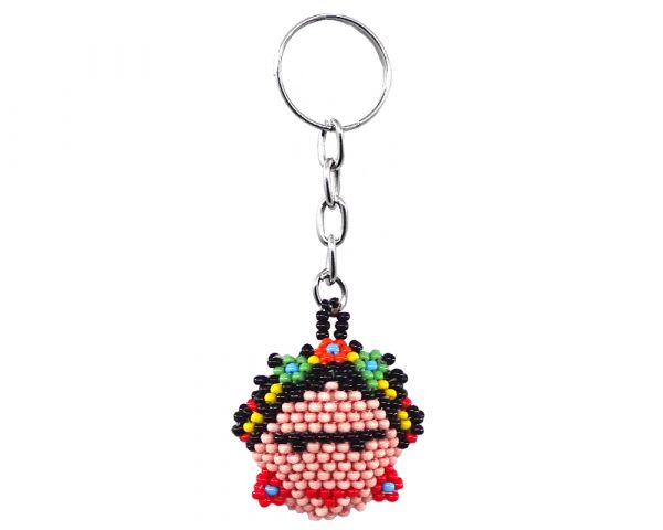 Handmade Czech glass seed bead figurine keychain of a Frida Kahlo head in peach, black, red, and multicolored color combination.