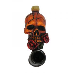 Handcrafted tobacco smoking hand pipe of a beige skull with red roses in its mouth in mini size.