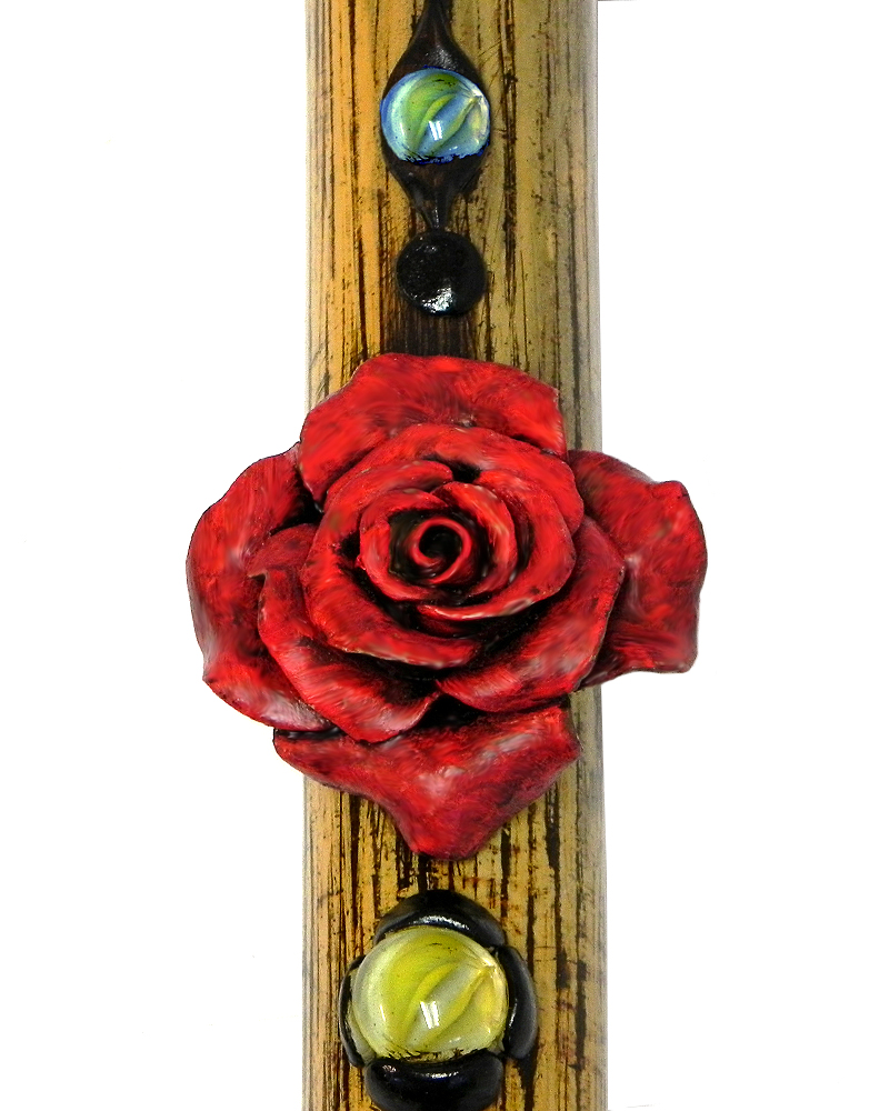 Handcrafted tobacco smoking natural bamboo wooden peace pipe of a red rose flower.