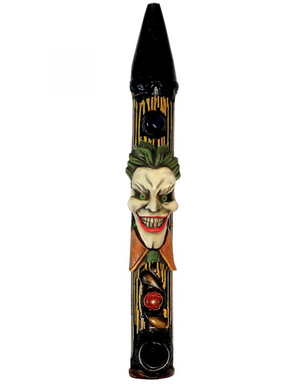 Handcrafted tobacco smoking natural bamboo wooden peace pipe of an evil clown character with a big head, creepy smile, green hair, and suit.