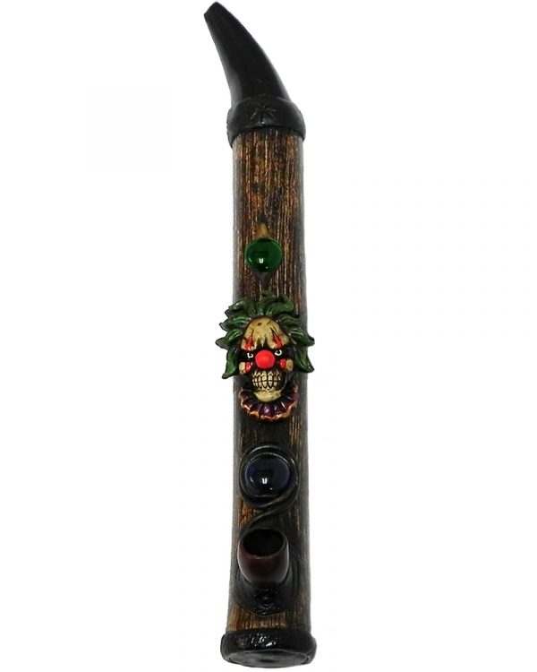 Handcrafted tobacco smoking natural bamboo wooden peace pipe of an evil clown head with a creepy smile and red nose.