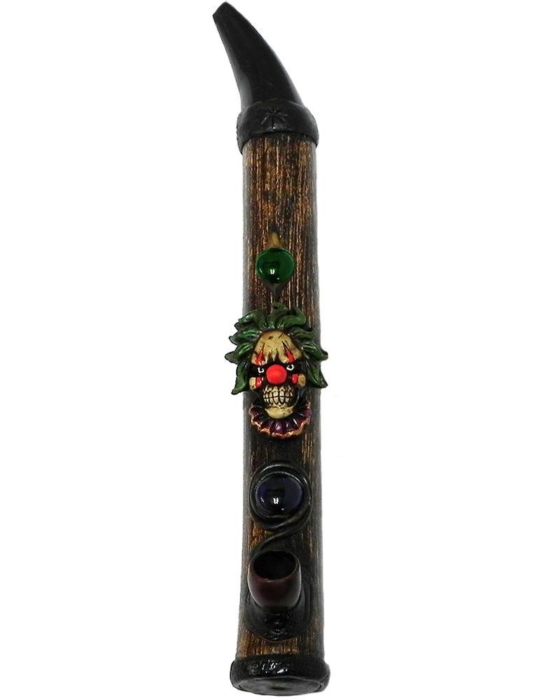 Handcrafted tobacco smoking natural bamboo wooden peace pipe of an evil clown head with a creepy smile and red nose.