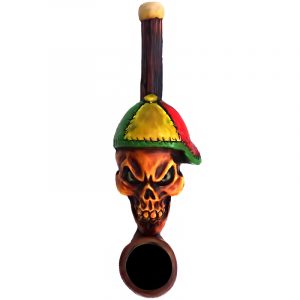 Handcrafted tobacco smoking hand pipe of an evil beige skull wearing a Rasta-colored hat in mini size.