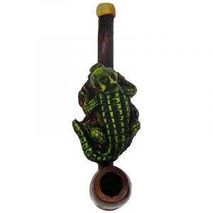 Handcrafted tobacco smoking hand pipe of a green alligator on a rock in small size.
