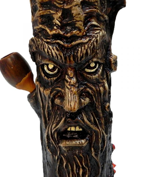 Handcrafted tobacco smoking water pipe of a brown tree stump man face.