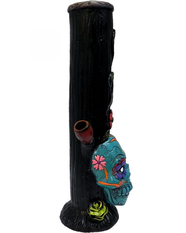 Handcrafted tobacco smoking water pipe of a Day of the Dead sugar skull with multicolored floral designs in turquoise blue color.