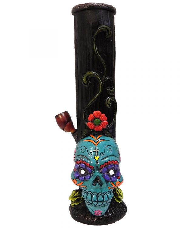 Handcrafted tobacco smoking water pipe of a Day of the Dead sugar skull with multicolored floral designs in turquoise blue color.