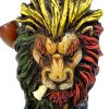 Handcrafted tobacco smoking water pipe of a smoking lion head with a scar on one eye, Rasta-colored mane, and green and gold peace sign necklace.